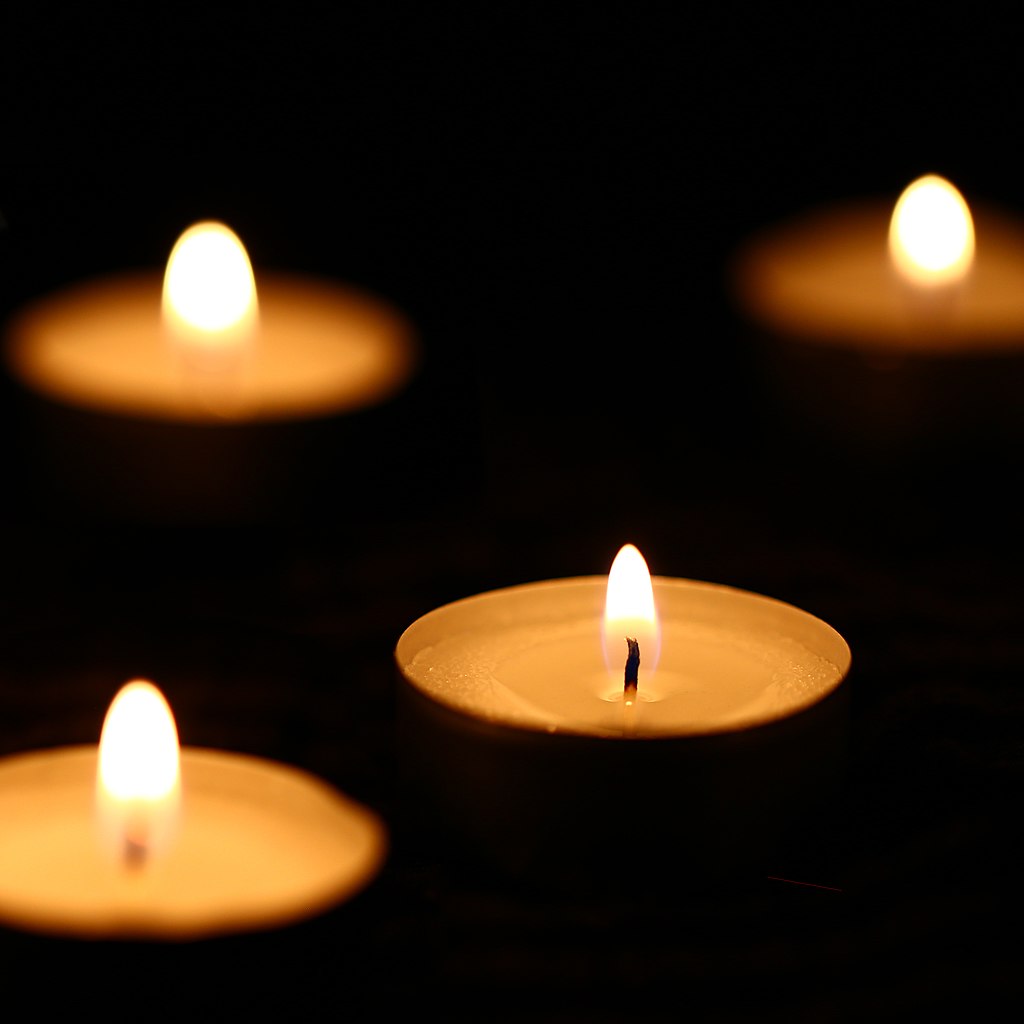 Christmas candles such as those lit at First Parish on Christmas Eve